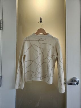 J.ING Cream Turtleneck Sweater with Tan Abstract Line Design